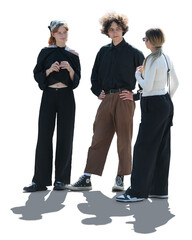 Group of backlit three young people standing and talking outside in the street isolated on...