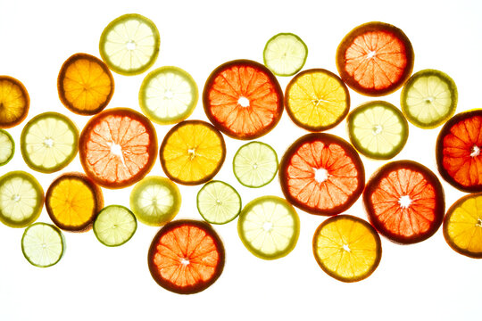 Vibrant citrus slices on light background