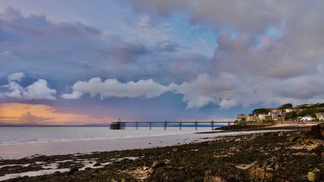 storm clouds over the pier beautiful coast at golden hour in England Clevedon 