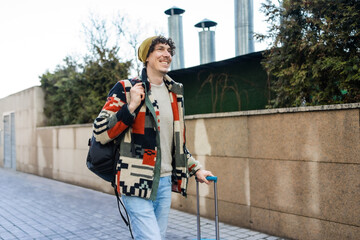 Businessman with suitcase enjoying outdoor travel experience