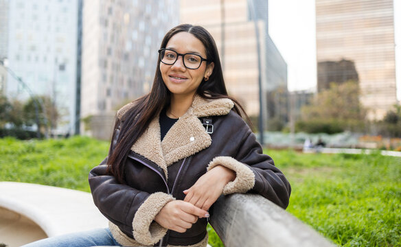 Hispanic woman enjoying outdoor business lifestyle in city