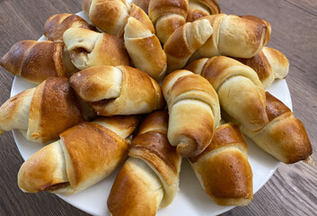A Beautifully Crafted Plate of Delicious, Fresh, and Homemade Croissants Ready for Your Enjoyment