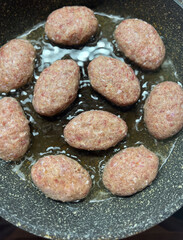 Savory and Flavorful Meatballs Cooking in a Pan on the Stovetop for a Delicious Meal
