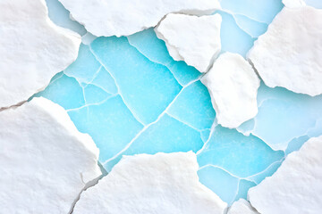 Naklejka premium Cracked white paint reveals light blue undercoat