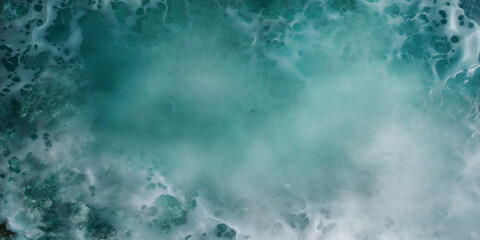 Fototapeta premium The image is of a body of water with a lot of bubbles and foam