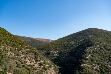 Naklejka premium Mountainous landscape covered with sparse flora in Mediterranean region