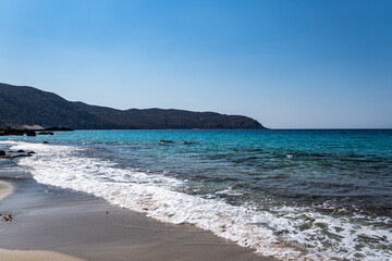 Landscape with single stones on the sandy coast of the Mediterranean Sea on the island of Crete