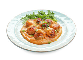 Fototapeta premium Delicious meatballs with gravy cream sauce, herbs and arugula isolated on white