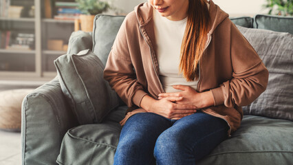 Young woman with stomach ache