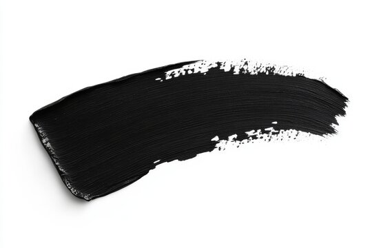 A dark face skin care product, the charcoal mud mask, has a texture that is displayed as a swatch isolated on a white background