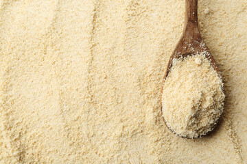Superfood product. Sesame seeds powder and spoon as background, closeup