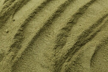 Superfood. Green onion powder as background, closeup