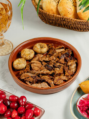 Roasted chicken in ceramic pot