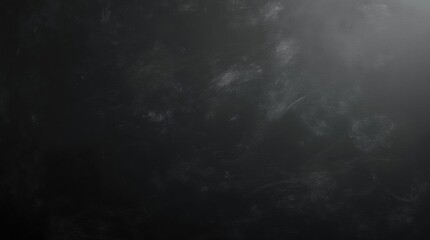 A textured black chalkboard surface with subtle scratches and dust, ideal for writing or drawing. Perfect for educational or creative backgrounds