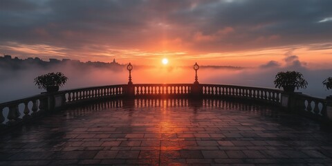 Obraz premium A dramatic sunset casts vibrant colors against a misty horizon, captivating the viewer's imagination.