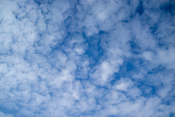 white clouds against the blue sky.