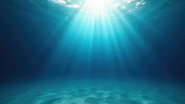 Deep blue underwater rays of sunlight burst through the ocean