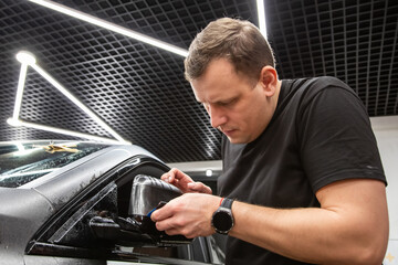The process of installing PPF, armored film on the car. PPF is a polyurethane, protective film that...