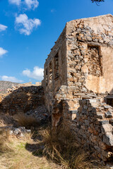Fototapeta premium Crumbling Stone Ruins Amid Dry Overgrowth