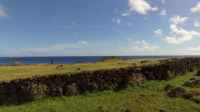 Explore the breathtaking beauty of Easter Island near Orongo volcano with avocado trees under blue skies