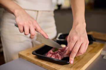 Mastering Skillful Meat Preparation Using a Very Sharp Knife for Culinary Excellence