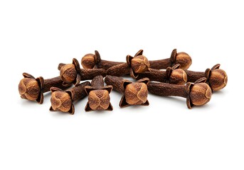 Fototapeta premium A pile of brown cloves arranged on a white background 