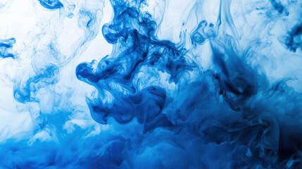 Blue ink gracefully disperses in water, creating captivating swirls and patterns that blend and contrast against a bright background during daylight