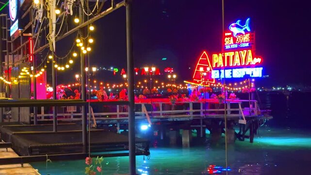 1 April 2025 colourful restaurant lights on Walking Street in Pattaya full of bars agogo clubs strip clubs restaurants street food and tourism in Pattaya Thailand
