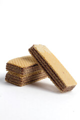 stack of sweet chocolate wafer snacks isolated on white background