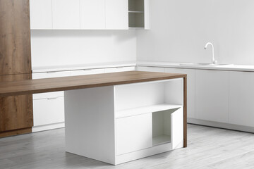 Interior of light kitchen with white drawers