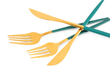 Golden forks and knives with green handles on white background