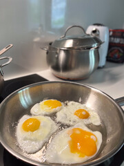 Frying Up Fresh Eggs in a Modern Kitchen Setup A Delightful Experience Every Time