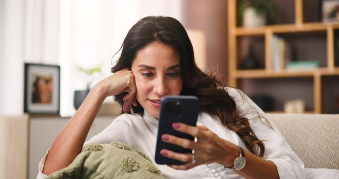 Happy, relax and woman with smartphone, home and reading ebook on website, online and living room. Chilling, reader and person with mobile for entertainment, laugh or tech for digital novel in house