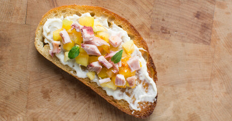 Overhead view of open sandwiches with chicken yellow tomatoes and peppers, top view of sandwich appetizer
