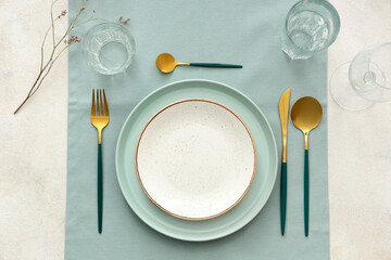 Stylish table setting with blue cloth on white background. Top view