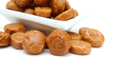 Caramel candies isolated on white background