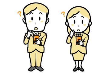 スマホを持ち、不思議そうな顔の、スーツを着た若い男女