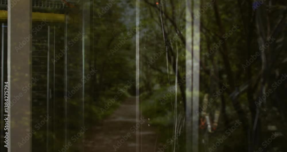Poster forest path seen through glass door with tree reflections creating animation effect