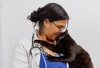 Portrait Of Happy Veterinarian Doctor Woman Holding A black pet, Posing With Healthy Patient Over...