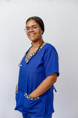 Medical concept of beautiful Brazilian female doctor in white coat with stethoscope, waist up....