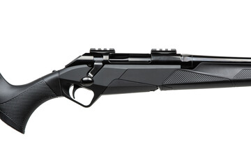 A close-up shot of a sleek black rifle with a bolt-action design, highlighting the trigger and...