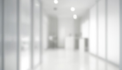 Blurred interior corridor with white walls and floor, illuminated by ceiling lights. Premium Abstract blurred background with light and soft colors.