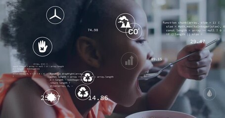 In school, child eating cereal with animation overlay of environmental data and icons - Powered by Adobe
