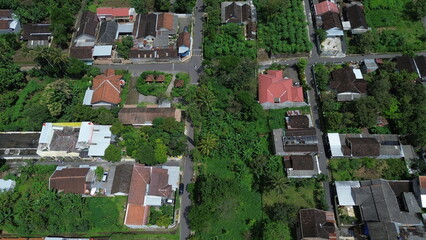 Aerial View of Indonesian Village with Traditional Rooftops