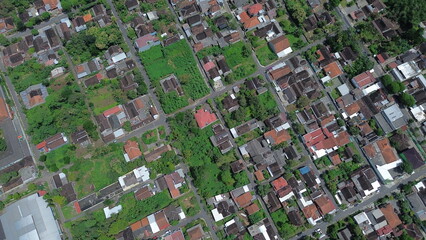Aerial View of Indonesian Village with Traditional Rooftops