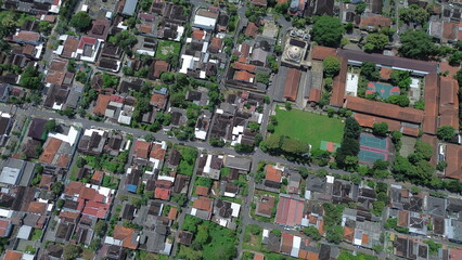 Aerial View of Indonesian Village with Traditional Rooftops