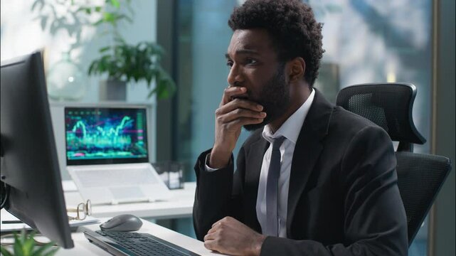Scared shocked African American man businessman sad failure male frustrated upset guy business manager employee working with computer bad news lose problem online shock stress pc trouble office worker