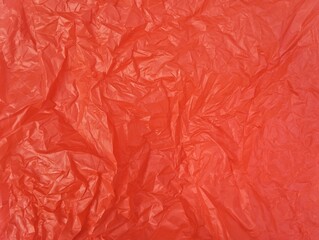 Obraz premium Abstrack red crumpled plastic bag texture background 