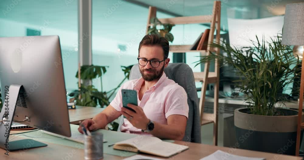 Poster Business, man and computer with smartphone in office for mobile notification, checking text message and happy. Corporate finance manager, person or smile with phone at desk for email and multitasking
