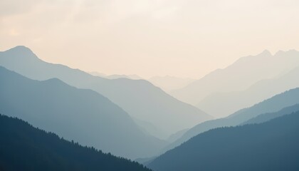 Soft, ethereal light bathes the mist covered mountain peaks as songbirds serenade the awakening world